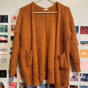 Soft knitted ochre slouchy cardigan with pockets